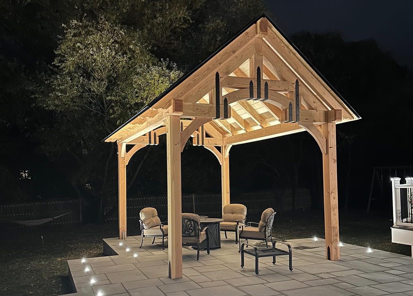 Night-lit timber-frame pavilion in Holmdel, New Jersey