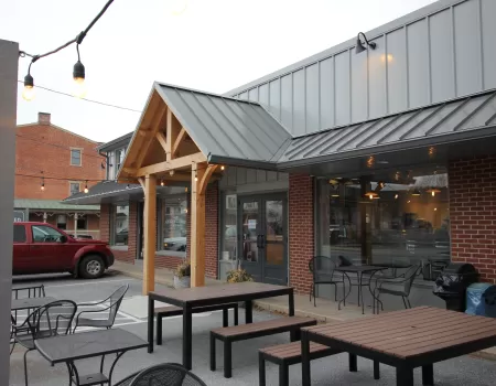Speckled Hen storefront in Strasburg with timber-frame entry and standing-seam roof