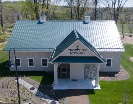 Thornbury Township building with green metal roof and cupolas
